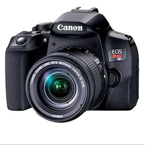 Cannon rebel with 18-55 mm lens, charger and camera strap.